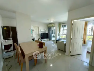 Spacious modern living room with dining area and natural light