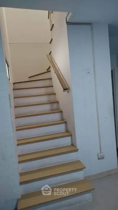 Modern staircase with wooden steps in a contemporary home interior