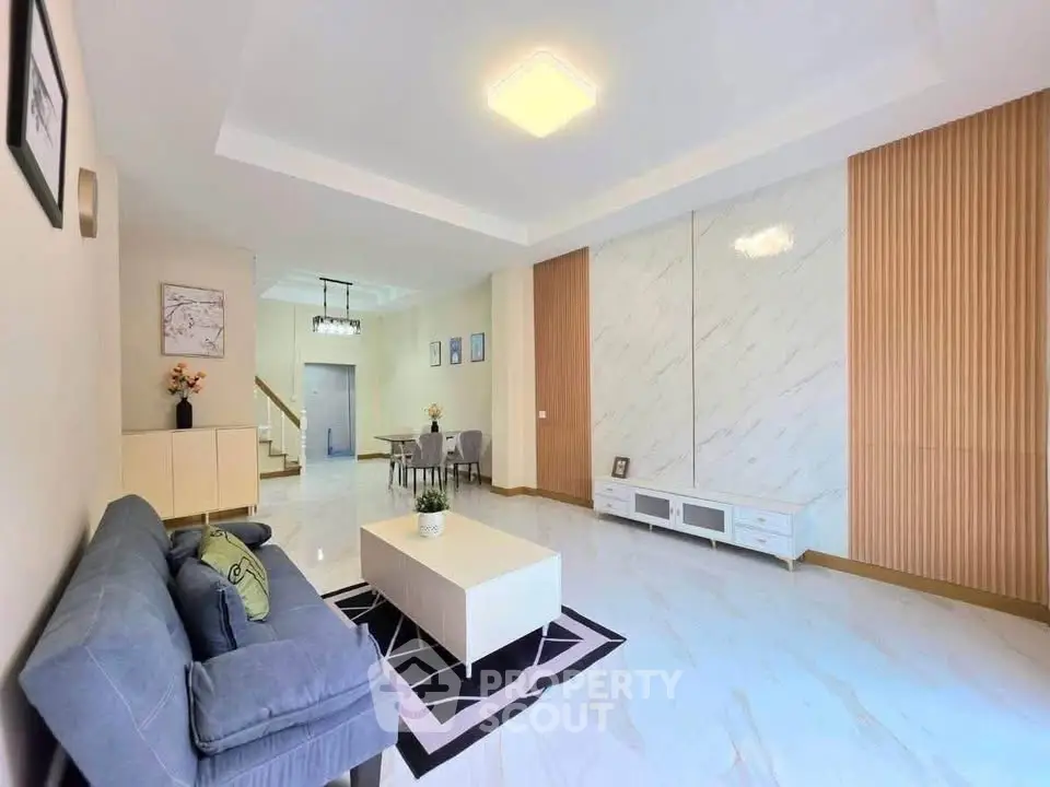 Spacious modern living room with elegant decor and ample natural light