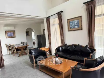 Elegant living room with classic furniture and dining area in open layout