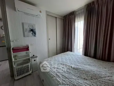 Cozy bedroom with air conditioning and elegant curtains in modern apartment.