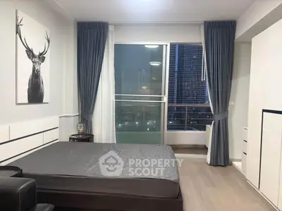 Modern bedroom with city view and stylish decor in high-rise apartment