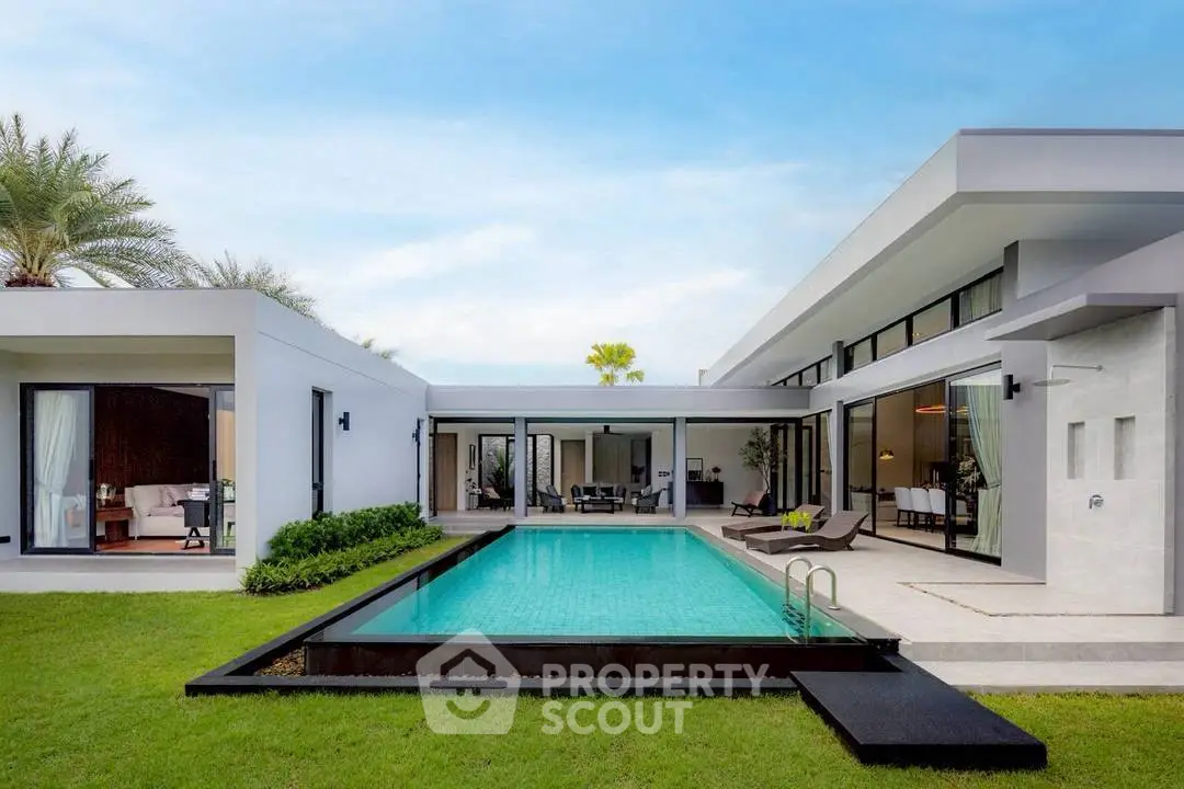 Luxurious modern villa with private pool and lush garden, perfect for serene living.