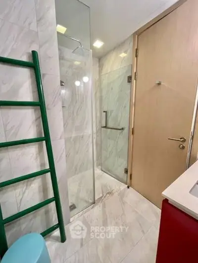 Modern bathroom with glass shower and sleek design