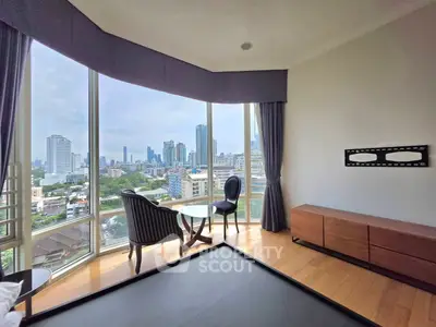 Luxurious high-rise apartment with stunning city view and elegant interior design.