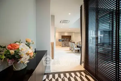 Luxurious open-plan living area with elegant dining space and modern decor