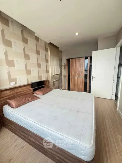 Spacious bedroom with modern decor and large bed in a stylish apartment