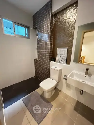 Modern bathroom with sleek design and stylish tiles
