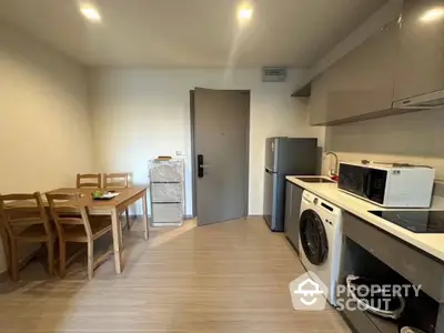 Spacious kitchen with modern appliances, ample cabinetry, and a cozy dining area, perfect for culinary enthusiasts seeking a functional and inviting space.