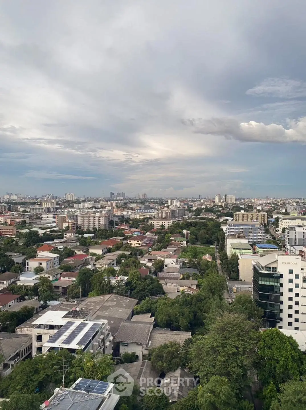 Stunning cityscape view with lush greenery and urban skyline