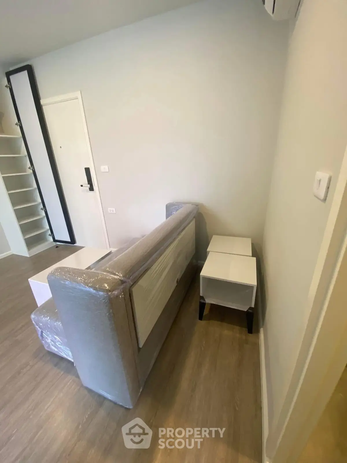 Modern apartment interior with new furniture and wooden flooring