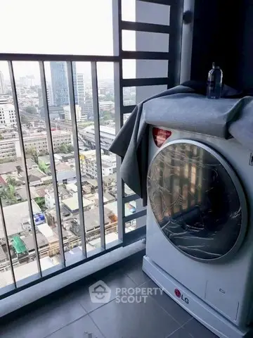 High-rise balcony with city view and modern washing machine setup.
