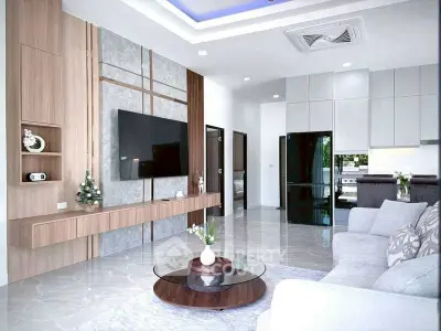 Modern living room with sleek design, featuring a large TV, stylish furniture, and open kitchen layout.