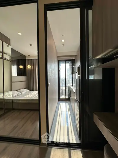Modern bedroom with balcony access and sleek design in urban apartment