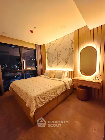 Luxurious bedroom with city view, elegant lighting, and modern decor