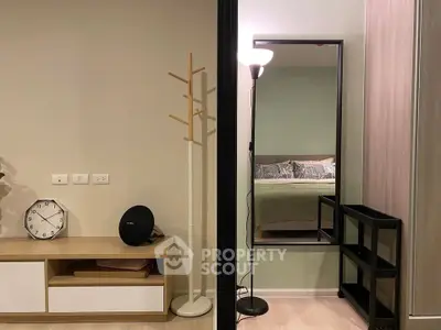 Modern bedroom with stylish decor and floor lamp