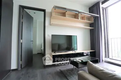 Modern living room with sleek TV setup and balcony view