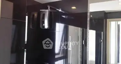 Modern bathroom with sleek black tiles and contemporary fixtures