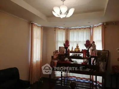 Cozy living room with elegant lighting and decorative display, perfect for relaxation and gatherings.
