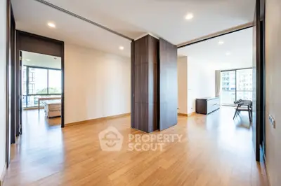 Spacious modern apartment with wooden flooring and large windows
