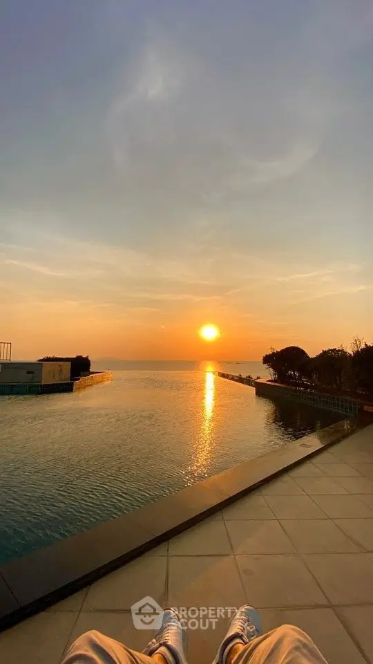 Stunning sunset view over infinity pool with serene ambiance