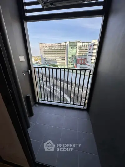 Modern balcony with city view, ideal for urban living and relaxation.