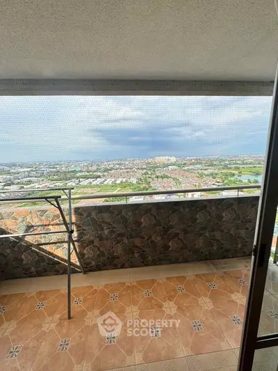 Spacious balcony with panoramic city view, perfect for relaxation and enjoying the skyline.