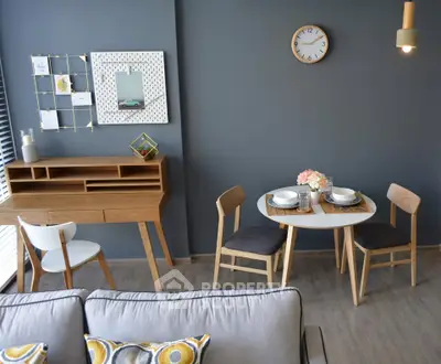 Modern living room with stylish furniture and dining area, featuring a cozy ambiance and contemporary design.