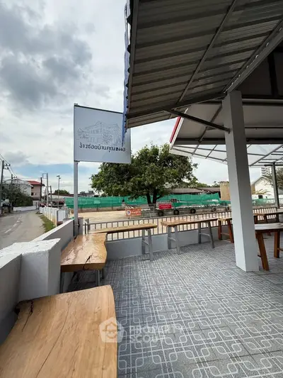 Spacious outdoor terrace with modern design and street view