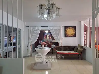 Elegant living room with chandelier and classic decor