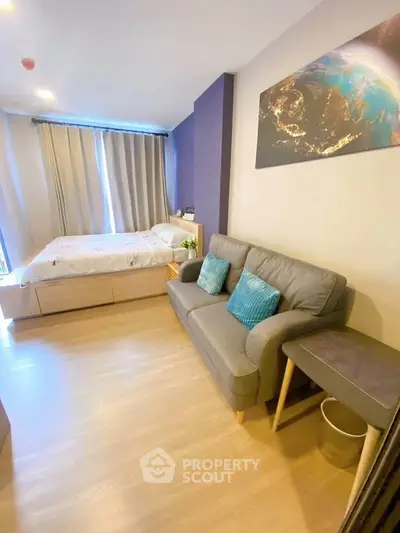 Modern studio apartment with cozy living area and stylish decor