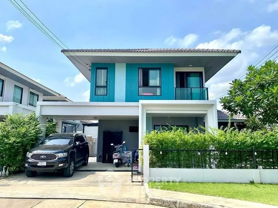 Modern two-story house with driveway and lush greenery in a suburban neighborhood.