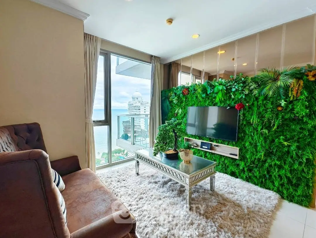 Luxurious living room with stunning ocean view and lush green wall