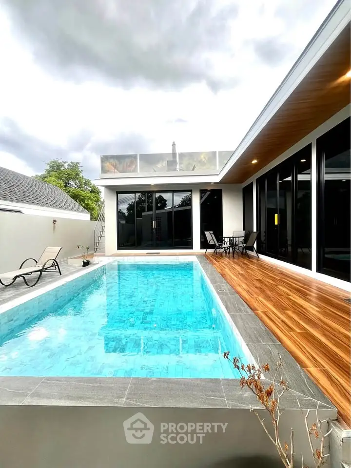 Luxurious modern home with private pool and stylish outdoor deck, perfect for relaxation and entertainment.