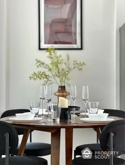 Elegant dining area with modern table setting and stylish decor