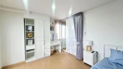 Bright and airy bedroom with modern decor and ample natural light