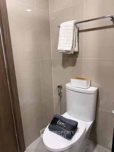 Modern bathroom with sleek fixtures and neutral tiles