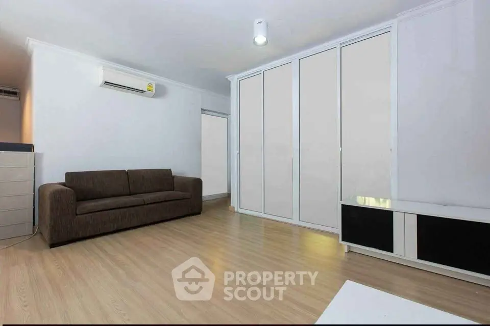 Spacious living room with modern sofa and sleek storage solutions