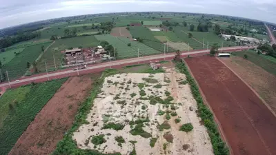 Expansive aerial view of lush farmland and development potential