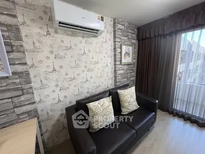 Chic living room with stylish wallpaper and cozy sofa in modern apartment