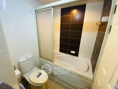 Modern bathroom with sleek bathtub and stylish tile design