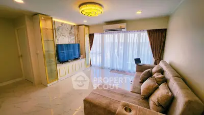 Luxurious living room with elegant marble accents and plush sofa