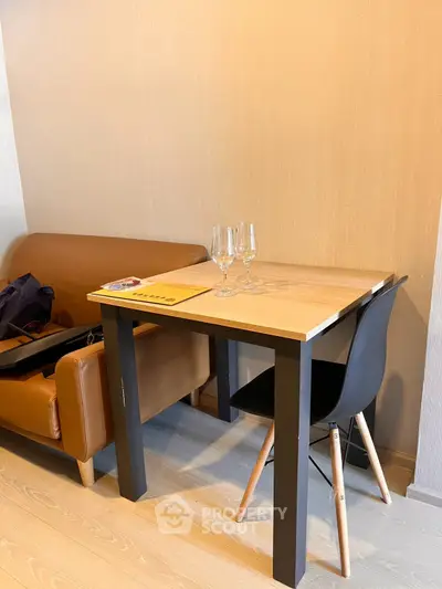 Modern apartment interior with stylish dining table and comfortable seating, perfect for urban living.