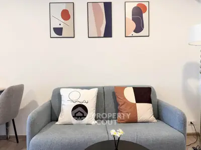 Modern living room with stylish abstract art and cozy sofa