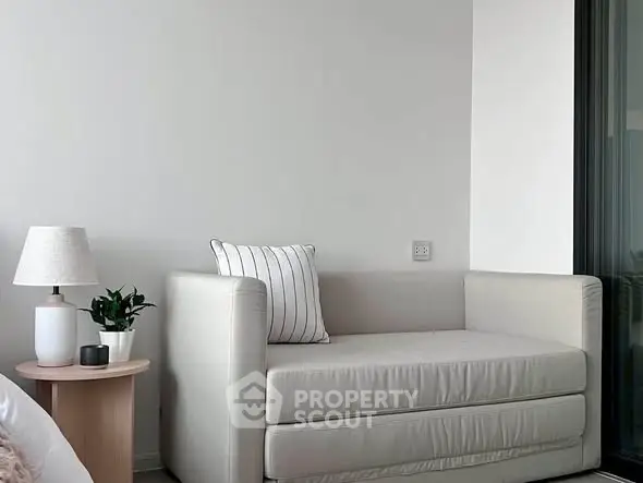 Modern minimalist living room with cozy sofa and stylish decor