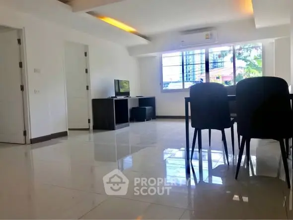 Spacious modern living room with sleek design and natural light