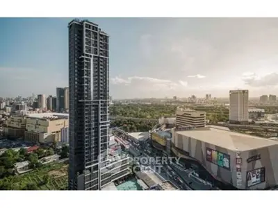 Stunning cityscape view featuring a modern high-rise building with panoramic skyline.