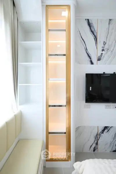 Luxurious modern living room with marble accents and built-in shelving