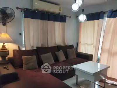 Cozy living room with sectional sofa and modern lighting