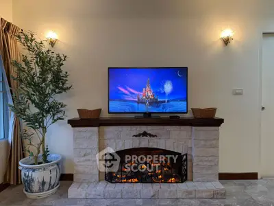 Cozy living room with elegant fireplace and modern TV setup
